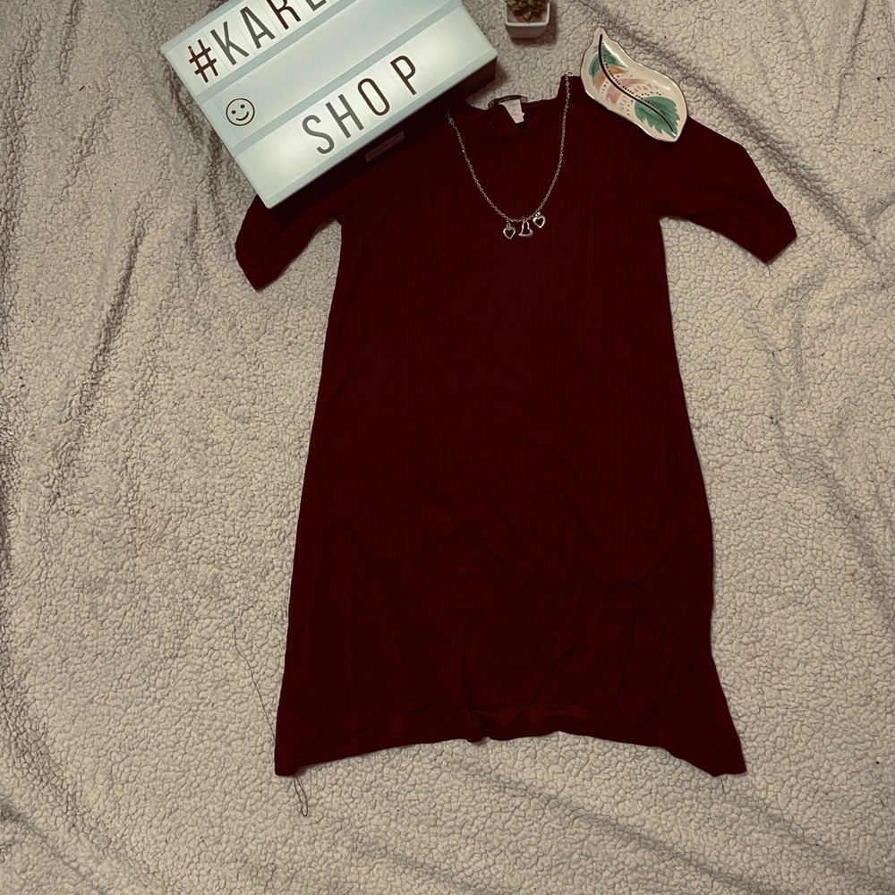 A maroon dress with necklace